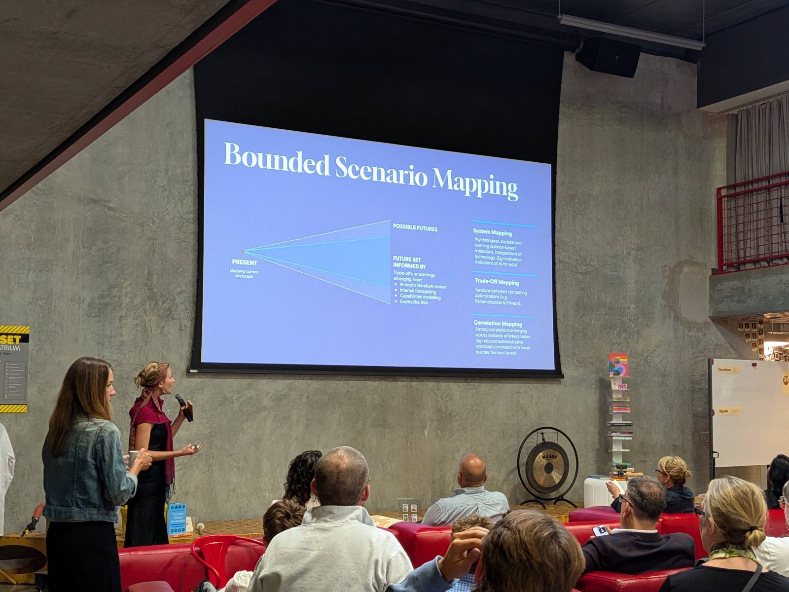 Lucy Calcott presenting a slide titled Bounded Scenario Mapping to a seated audience